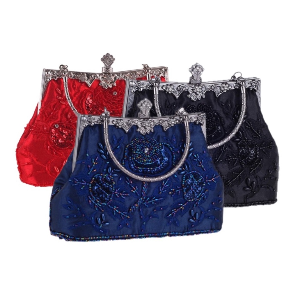 elegant vintage-inspired handbag w/ clasp closure. comes with dust bag.NWT